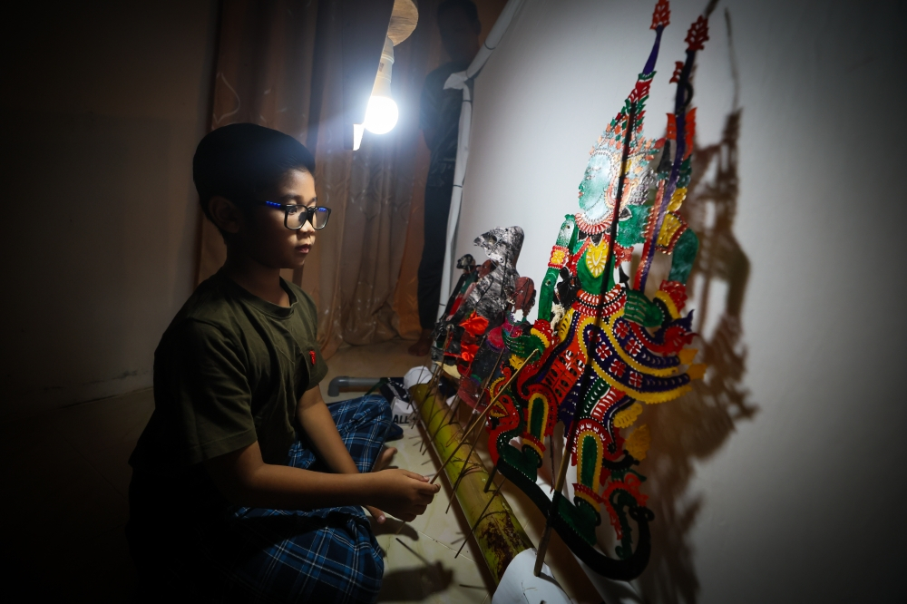 ‘I want to be a doctor, but I also want to play wayang kulit’: Meet the 10-year-old Kelantan boy keeping traditional art alive