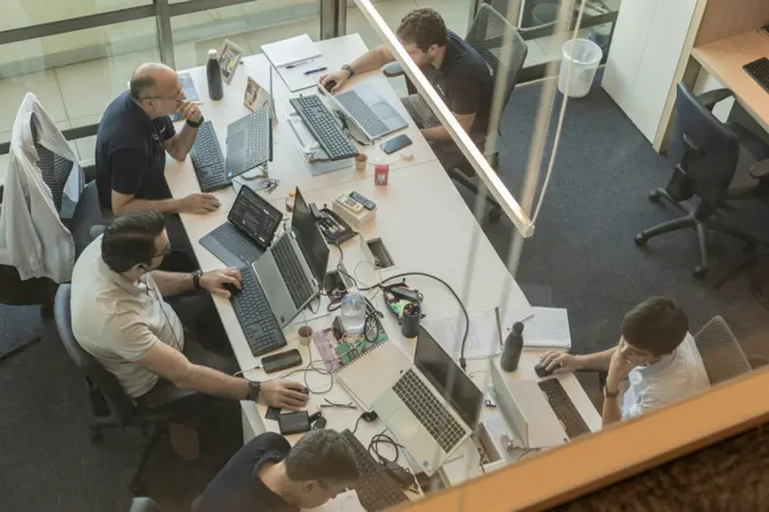 Companies push employees to use AI – just not too much