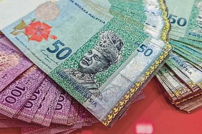 Ringgit opens higher versus greenback on upbeat GDP data