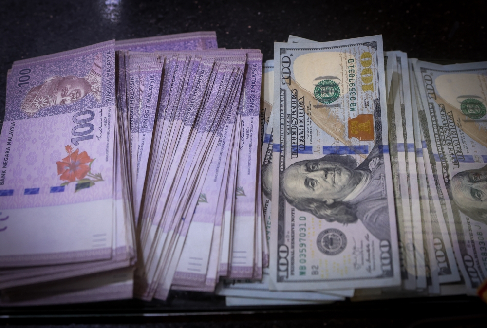 Ringgit firms further against US dollar as improving sentiment lifts demand